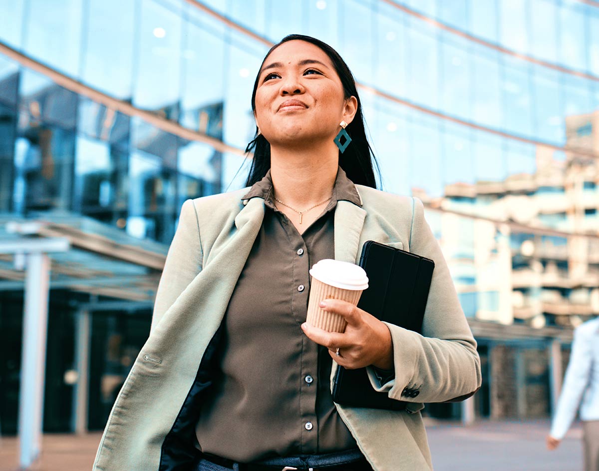 Woman walking by office building
