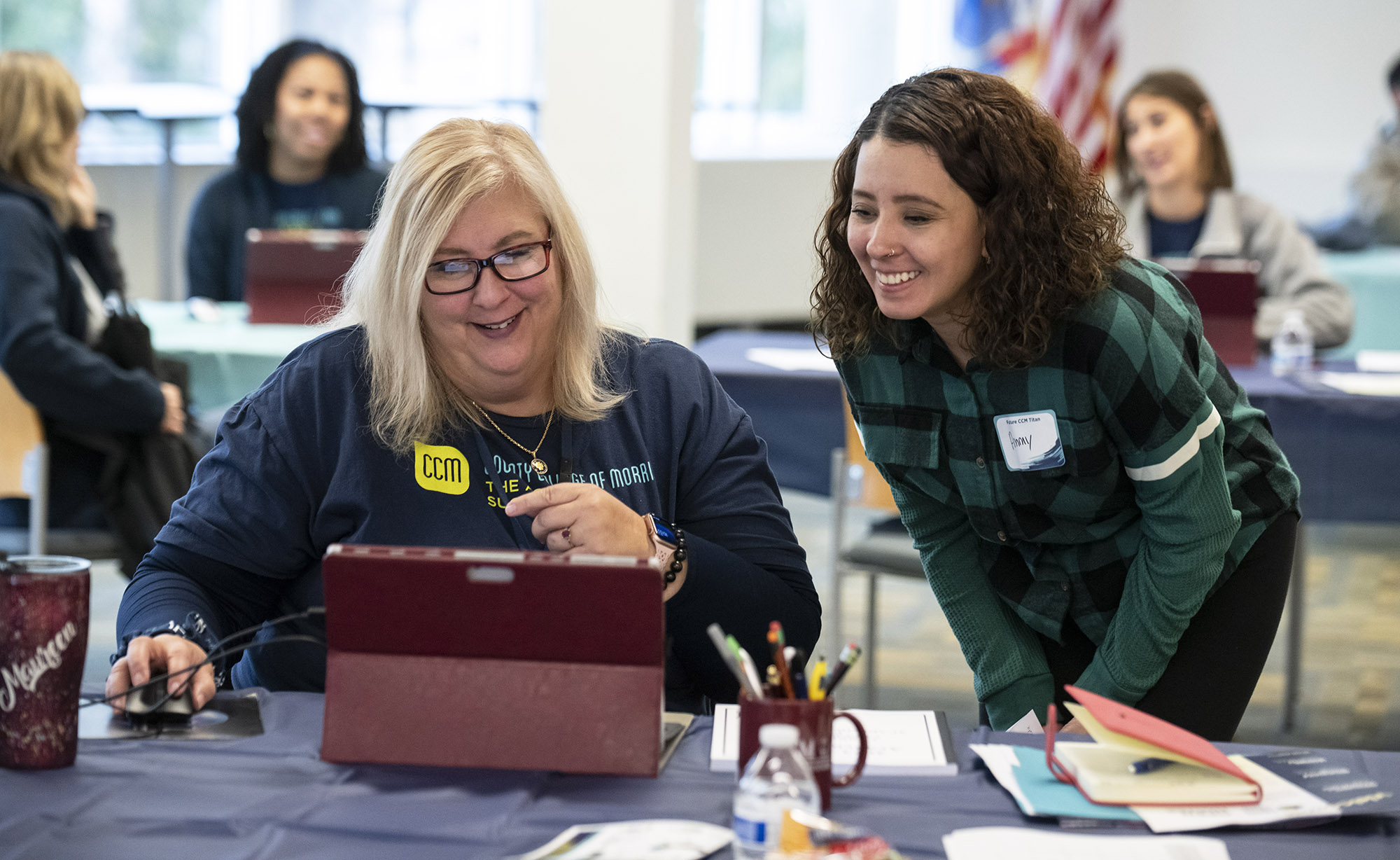 Image of advisor assisting a student