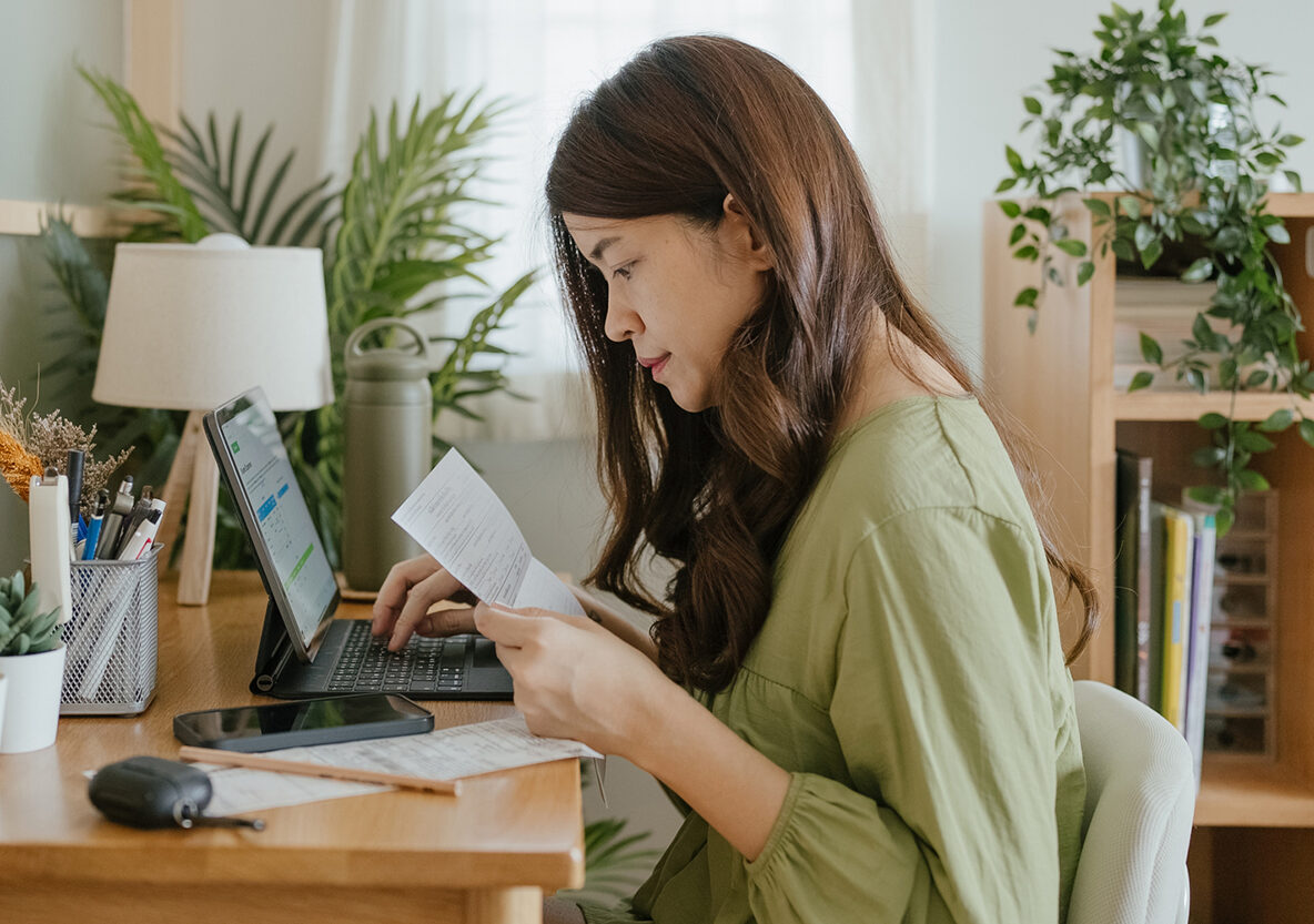 Image of student working at laptop at home