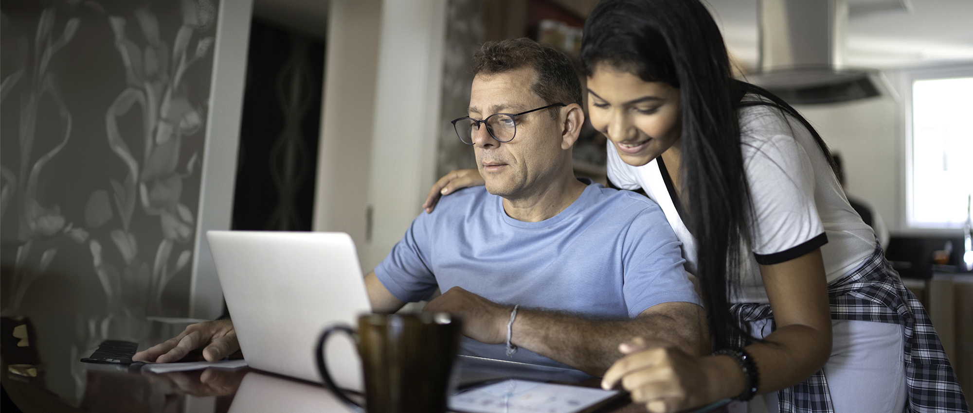 Image of student and parent looking at computer