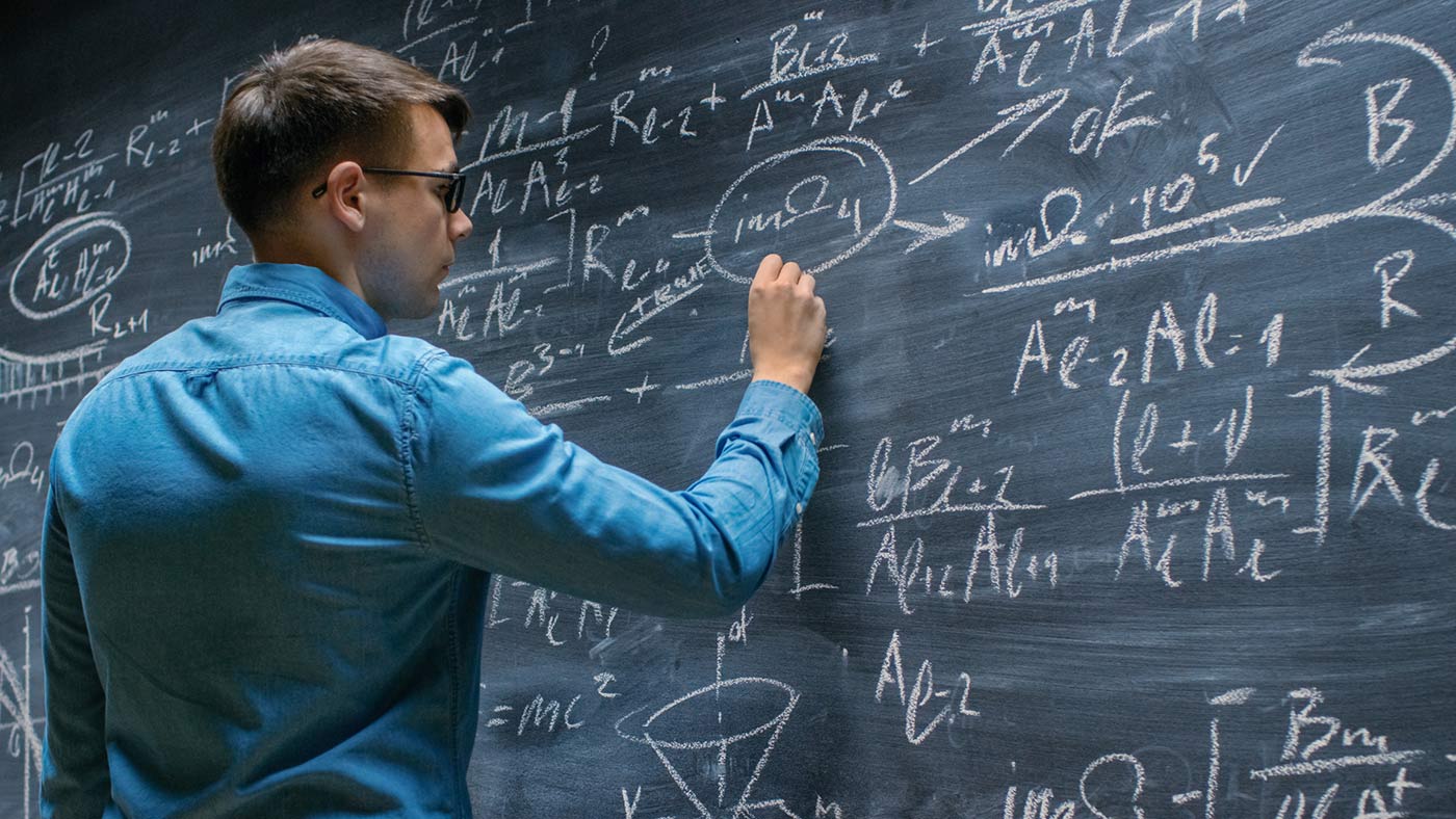 Math student at blackboard