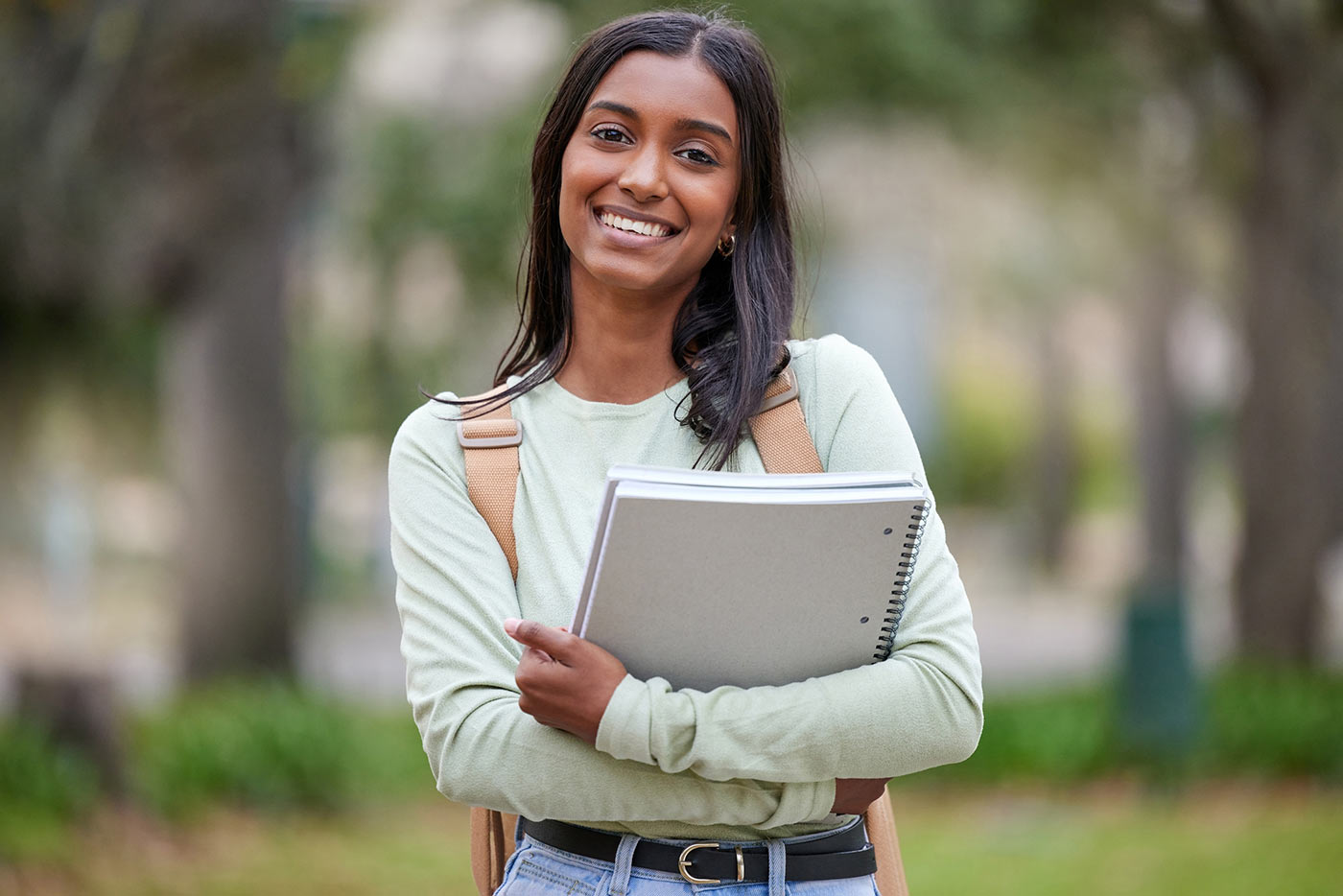 Student holding notebooks