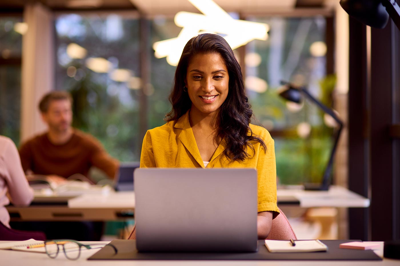 Woman in office using computer