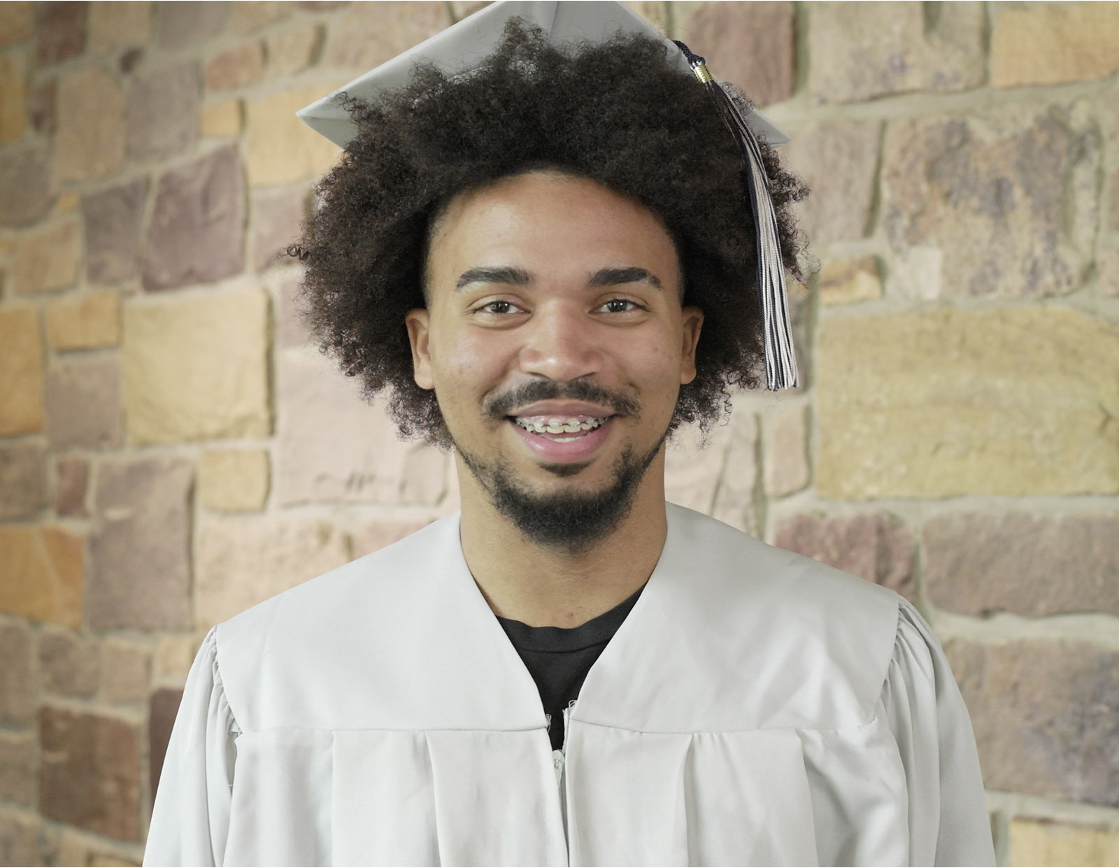 Another male student with graduation robe