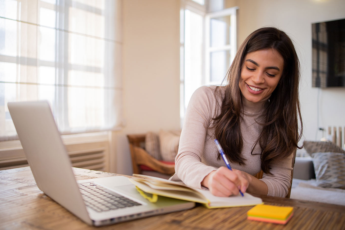 Woman writing in a notebook