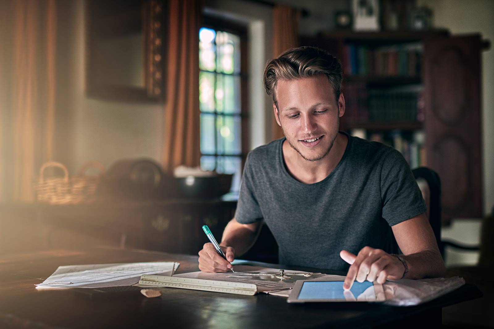 Male student working at home