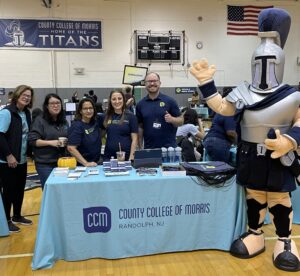 CCM Admissions Team and Titus mascot waving hello