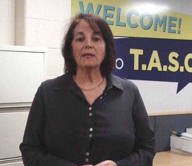 Jill Wells explaining the services available through TASC