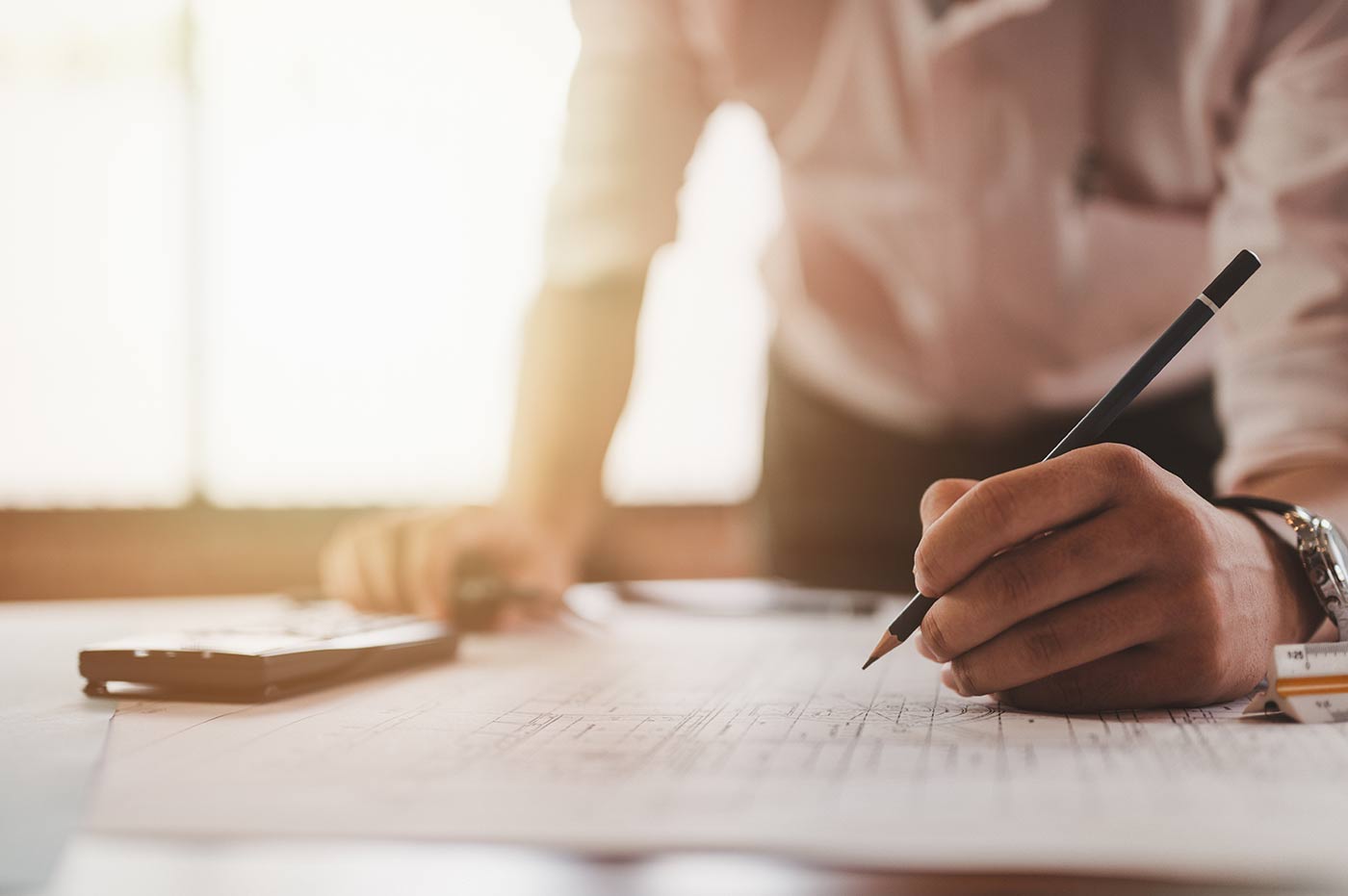 Image of person working on math problems