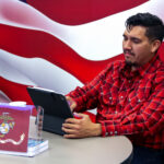 Veteran sitting at a table in the Veterans Center