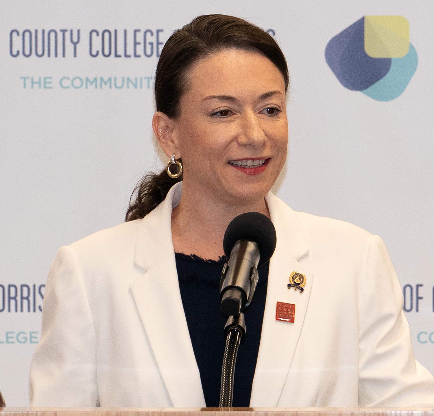 Aura Dunn at a microphone