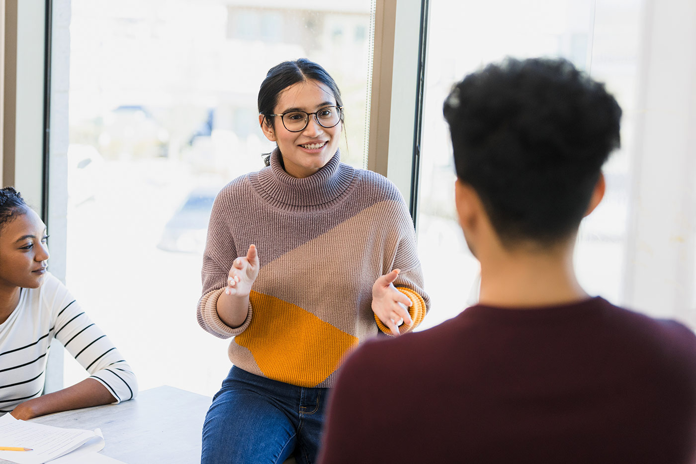 Professor with student in a classroom.